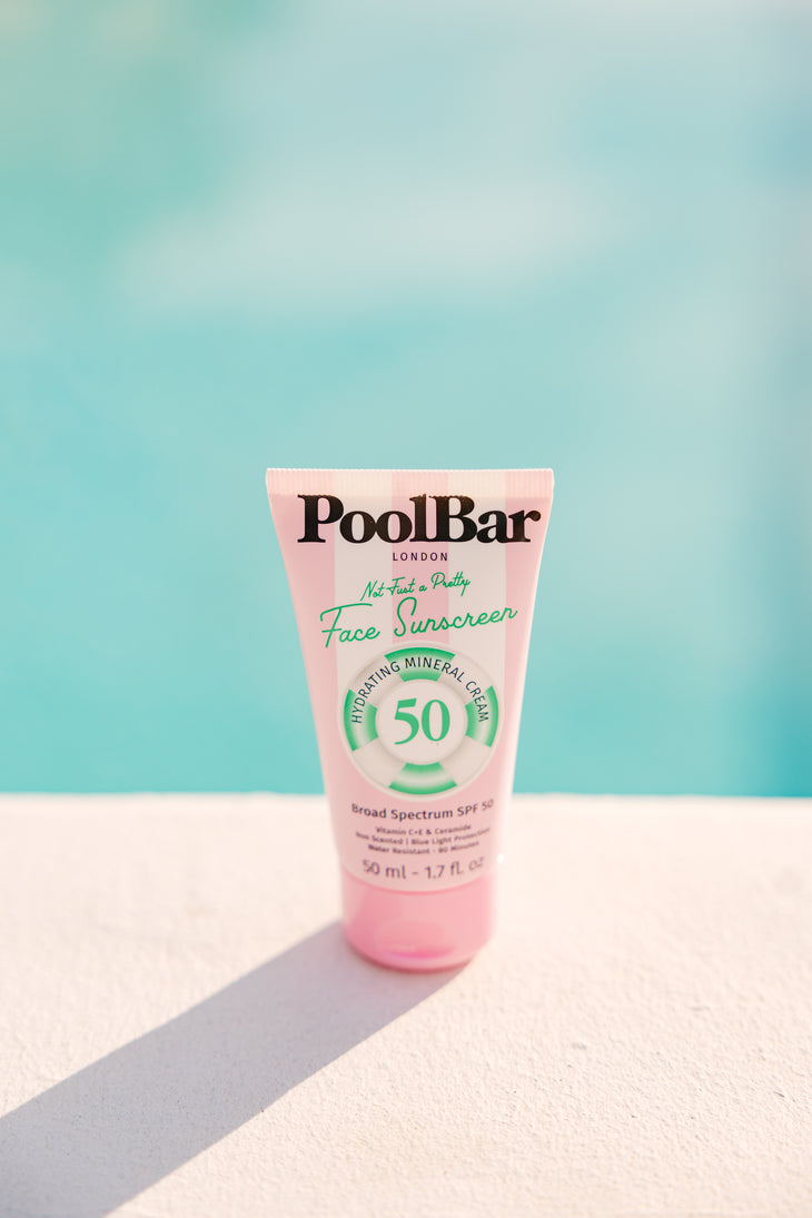 Pink tube of PoolBar London SPF 50 face sunscreen with hydrating mineral formula and blue light protection — PoolBar London | Endless UAE