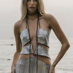 Silver sequined cut-out mini dress with halter neck tie and bodycon fit on beach — Formidable by Mina | Endless UAE