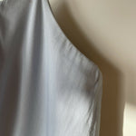 Woman wearing light blue sleeveless midi dress with corset top and full skirt — Endless | Endless UAE