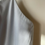 Woman wearing light blue sleeveless midi dress with corset top and full skirt — Endless | Endless UAE