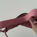 Pink leather mini shoulder bag with dual handles displayed against neutral background — By Far | Endless UAE