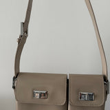 Beige patent leather shoulder bag with dual compartments and silver turnlock closures — Endless | Endless UAE