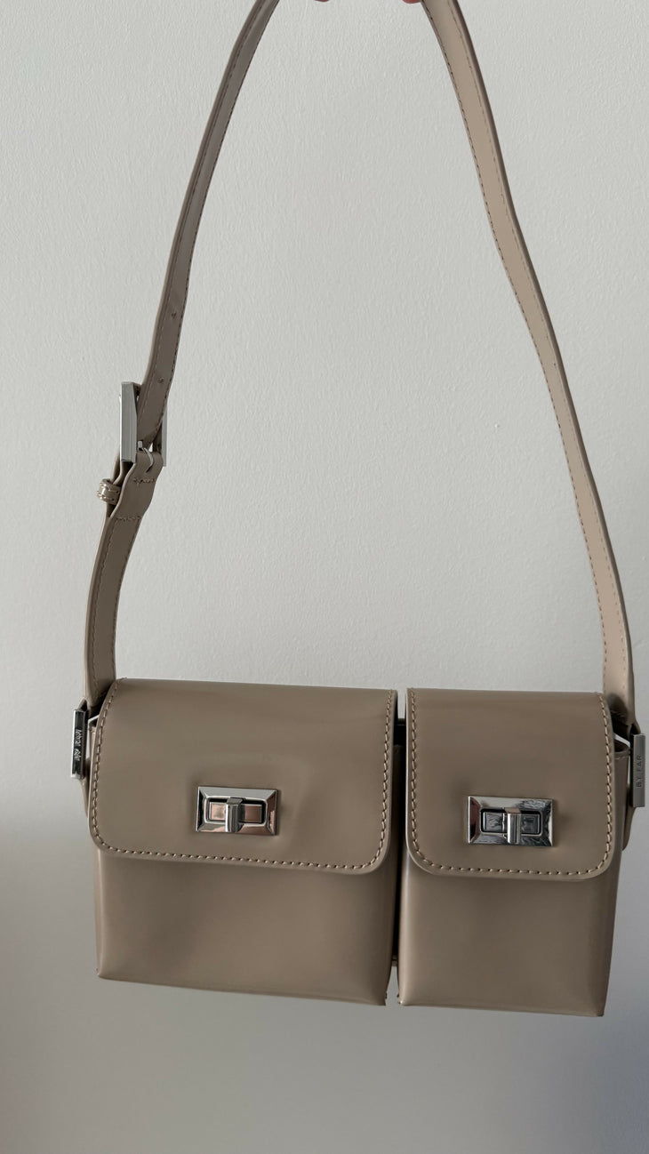Beige patent leather shoulder bag with dual compartments and silver turnlock closures — Endless | Endless UAE