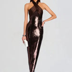 Woman wearing brown sequin halter dress with draped neckline and black heels — Retrofête | Endless UAE