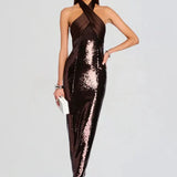 Woman wearing brown sequin halter dress with draped neckline and black heels — Retrofête | Endless UAE