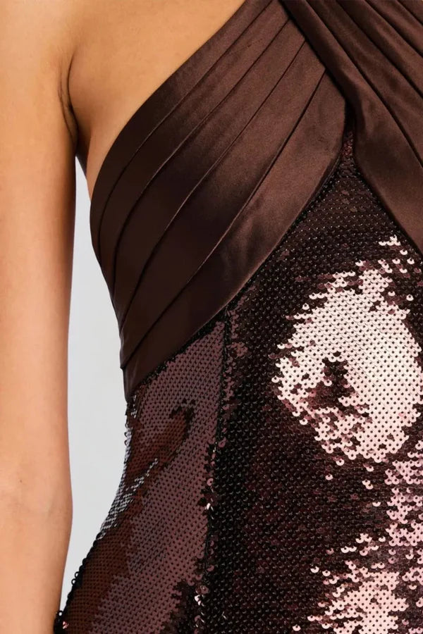 Woman wearing brown sequin halter dress with draped neckline and black heels — Retrofête | Endless UAE