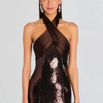 Woman wearing brown sequin halter dress with draped neckline and black heels — Retrofête | Endless UAE