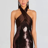 Woman wearing brown sequin halter dress with draped neckline and black heels — Retrofête | Endless UAE