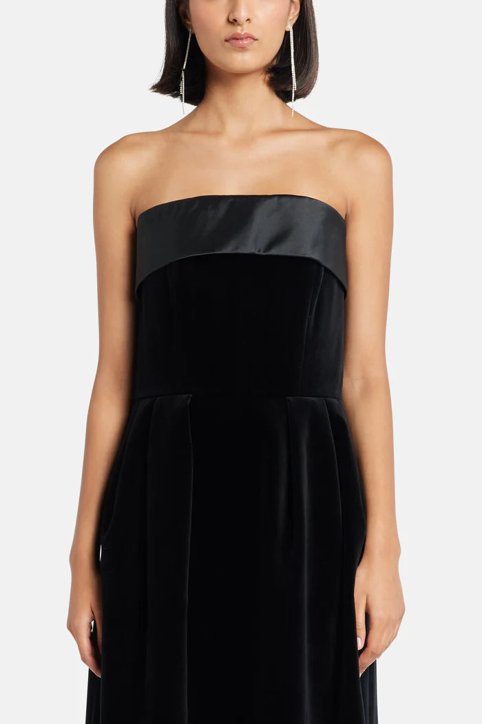 Black velvet strapless gown with satin trim and silver clutch — Dice Kayek | Endless UAE