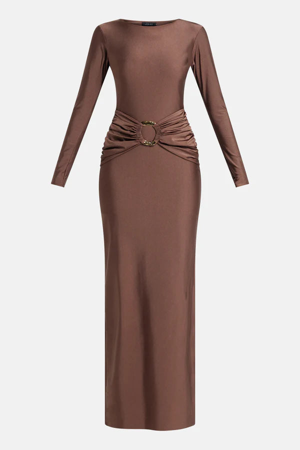 Woman wearing brown long-sleeve maxi dress with ruched waist belt and gold clutch — Lediel | Endless UAE