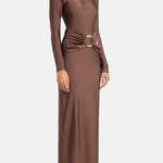 Woman wearing brown long-sleeve maxi dress with ruched waist belt and gold clutch — Lediel | Endless UAE