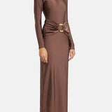 Woman wearing brown long-sleeve maxi dress with ruched waist belt and gold clutch — Lediel | Endless UAE