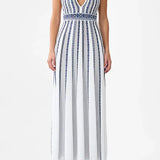 Woman wearing striped halter neck sleeveless knit maxi dress with navy and white vertical stripes — Camilla | Endless UAE