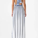 Woman wearing striped halter neck sleeveless knit maxi dress with navy and white vertical stripes — Camilla | Endless UAE