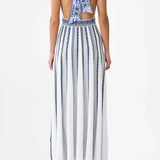 Woman wearing striped halter neck sleeveless knit maxi dress with navy and white vertical stripes — Camilla | Endless UAE