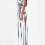 Woman wearing striped halter neck sleeveless knit maxi dress with navy and white vertical stripes — Camilla | Endless UAE
