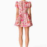 Woman wearing pink floral mini dress with short puffed sleeves and tie-front neckline — Elliatt | Endless UAE