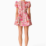Woman wearing pink floral mini dress with short puffed sleeves and tie-front neckline — Elliatt | Endless UAE