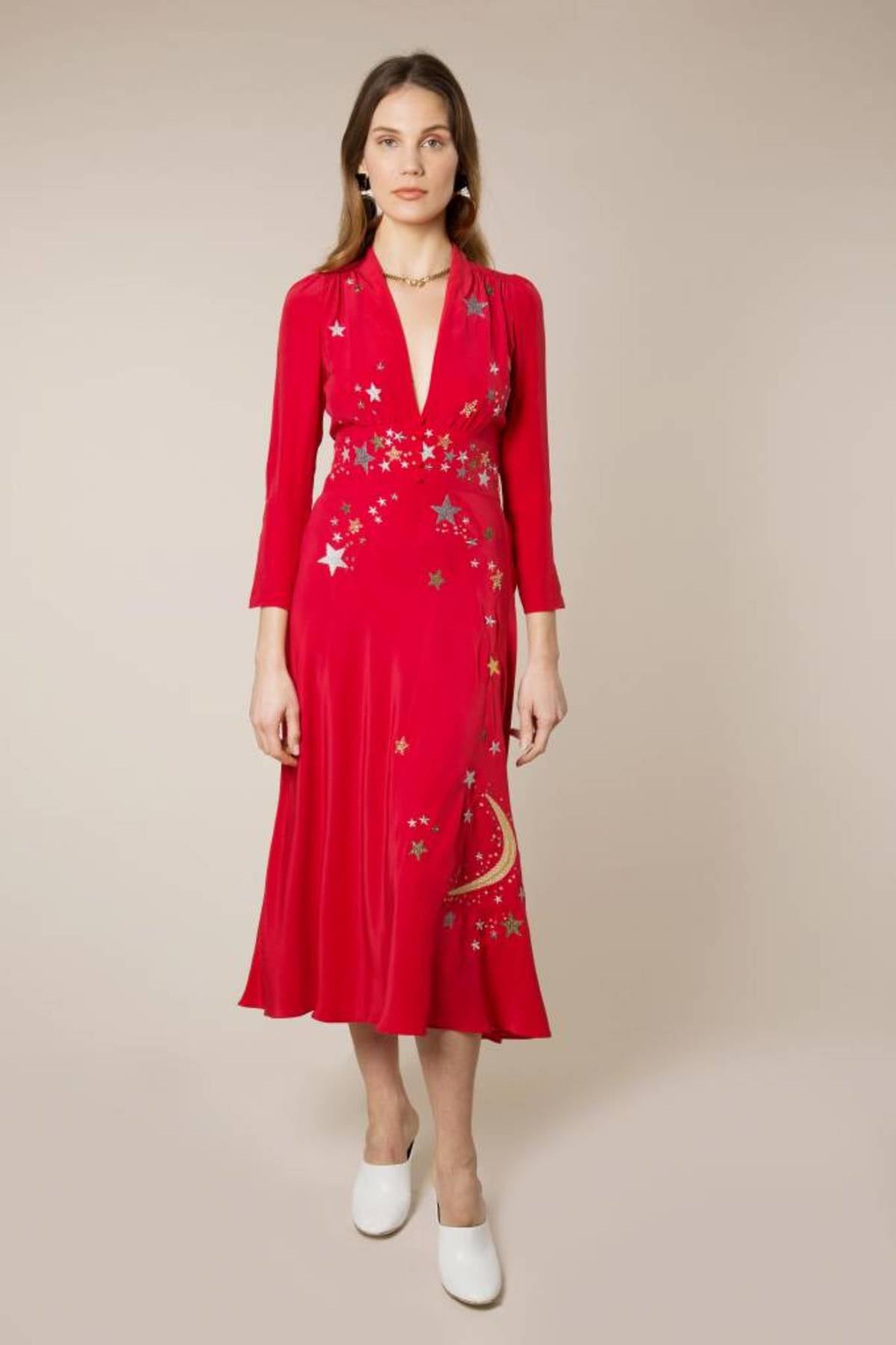 Woman wearing red midi wrap dress with gold and silver star embroidery, styled with white slip-on shoes — RIXO | Endless UAE