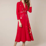 Woman wearing red midi wrap dress with gold and silver star embroidery, styled with white slip-on shoes — RIXO | Endless UAE