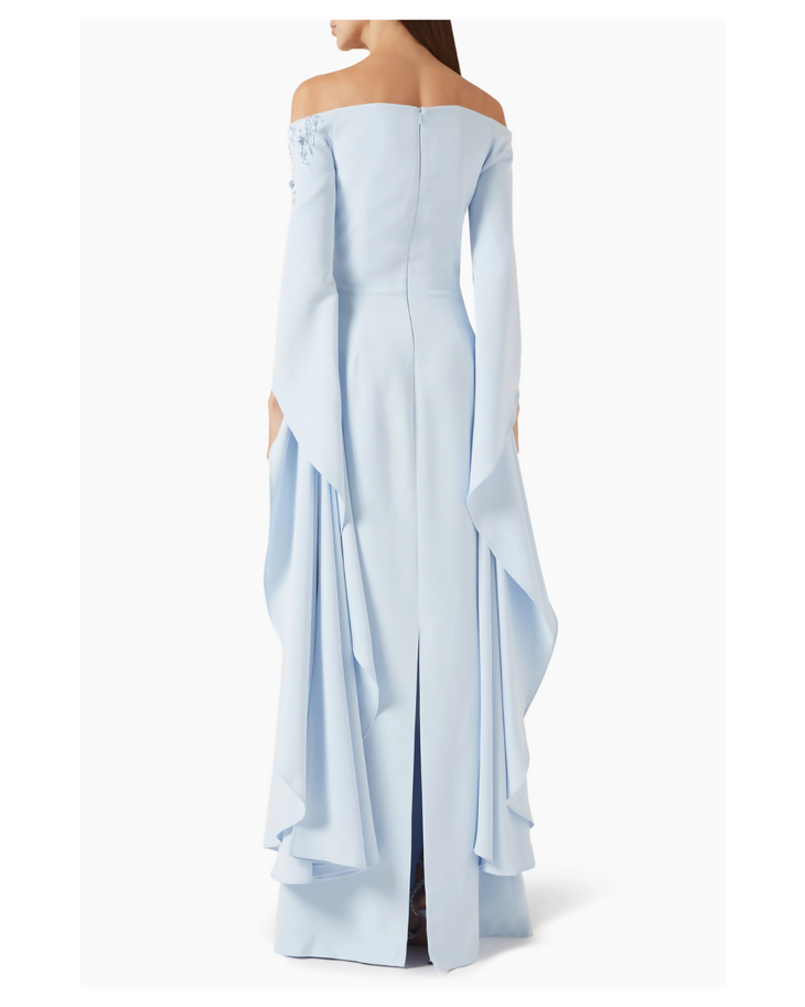 Light blue off-shoulder gown with beaded detail, long sleeves, and dramatic draped high-low skirt — Heva | Endless UAE