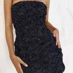 Black strapless mini dress with textured rose embellishments, fitted bodycon silhouette — Runaway The Label | Endless UAE