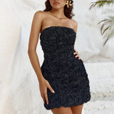 Black strapless mini dress with textured rose appliqué detail and fitted silhouette — Runaway The Label | Endless UAE