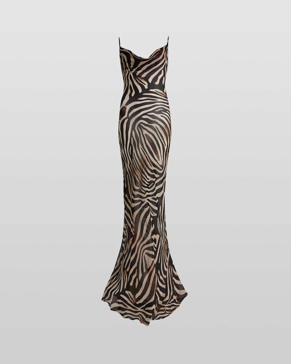 Woman wearing black and cream zebra stripe maxi dress with cowl neckline — Endless | Endless UAE