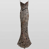 Woman wearing black and cream zebra stripe maxi dress with cowl neckline — Endless | Endless UAE