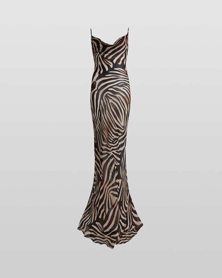 Woman wearing black and cream zebra stripe maxi dress with cowl neckline — Endless | Endless UAE