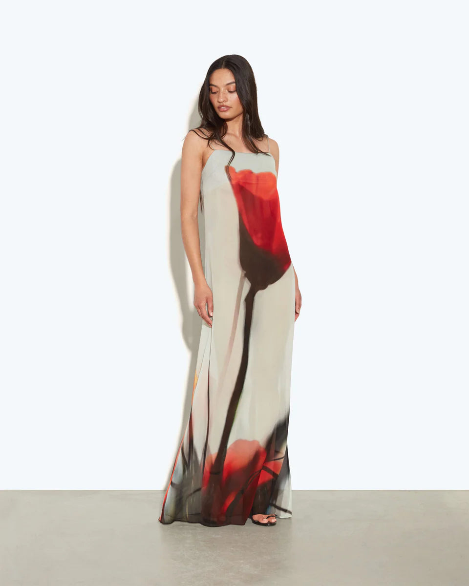 Woman wearing Luciana Dress with red floral print on cream background, viewed from back — Rat & Boa | Endless UAE