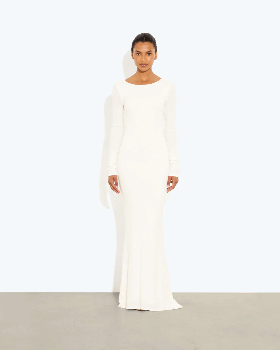 Woman wearing a cream long-sleeved fitted maxi dress with a crew neckline — Rat & Boa | Endless UAE