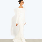 Woman wearing a cream long-sleeved fitted maxi dress with a crew neckline — Rat & Boa | Endless UAE