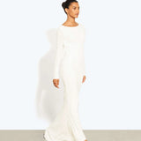 Woman wearing a cream long-sleeved fitted maxi dress with a crew neckline — Rat & Boa | Endless UAE