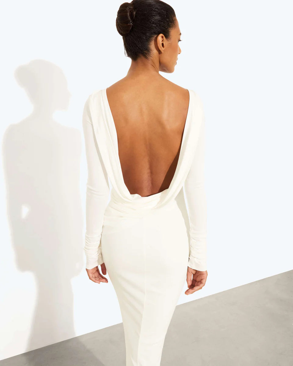 Woman wearing a cream long-sleeved fitted maxi dress with a crew neckline — Rat & Boa | Endless UAE