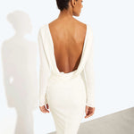 Woman wearing a cream long-sleeved fitted maxi dress with a crew neckline — Rat & Boa | Endless UAE