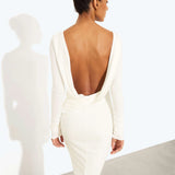 Woman wearing a cream long-sleeved fitted maxi dress with a crew neckline — Rat & Boa | Endless UAE