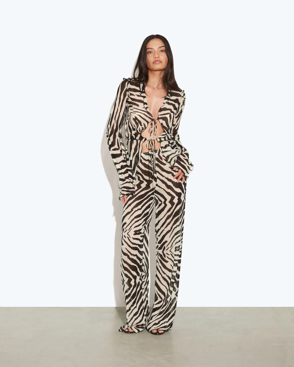 Woman wearing zebra print two-piece set with drawstring crop top and wide-leg pants — Rat & Boa | Endless UAE