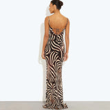 Woman wearing black and cream zebra stripe maxi dress with cowl neckline — Endless | Endless UAE