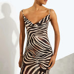 Woman wearing black and cream zebra stripe maxi dress with cowl neckline — Endless | Endless UAE
