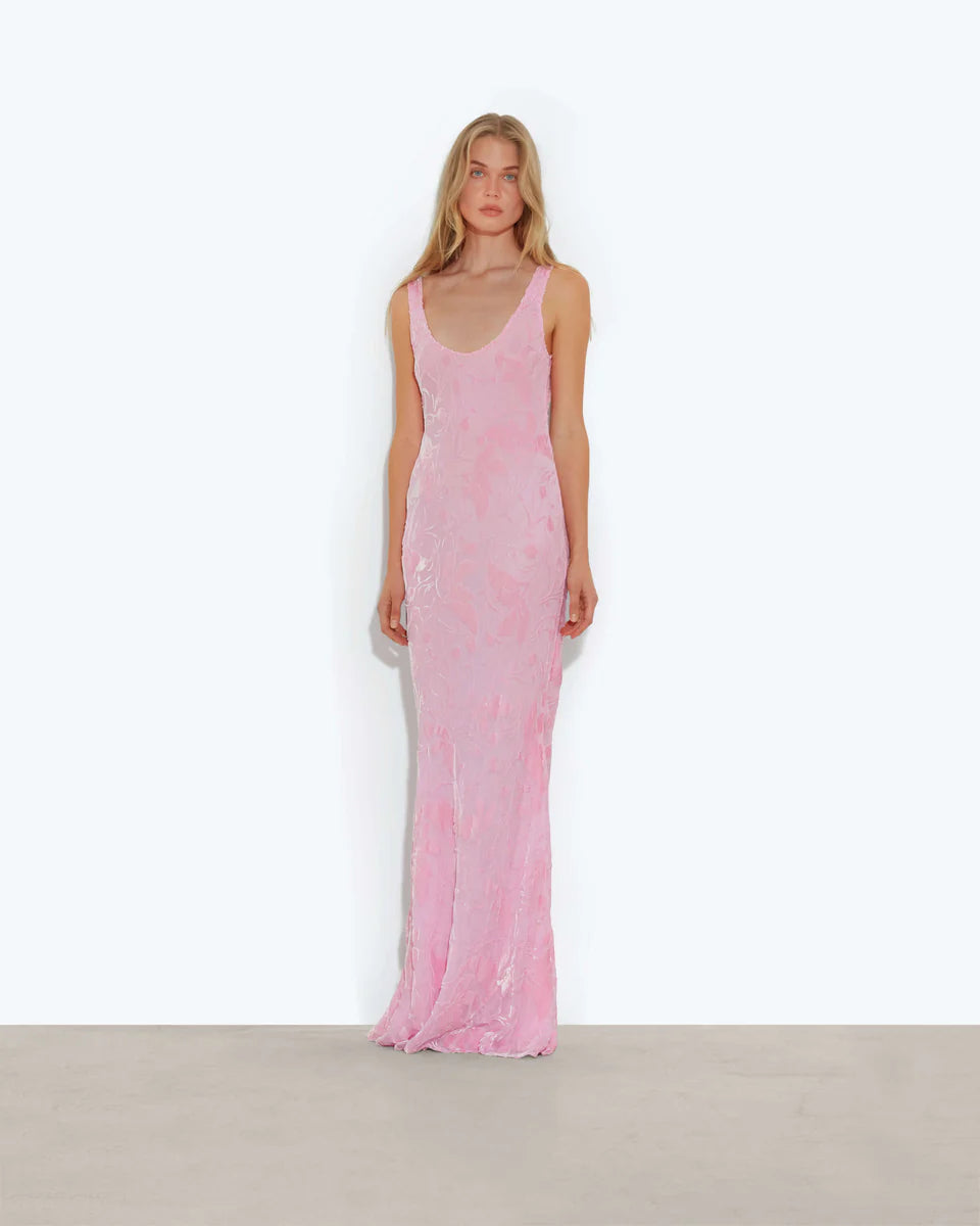 Woman wearing pink sleeveless maxi dress standing between dried palm fronds — Rat & Boa | Endless UAE