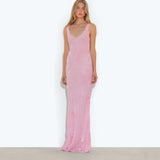 Woman wearing pink sleeveless maxi dress standing between dried palm fronds — Rat & Boa | Endless UAE