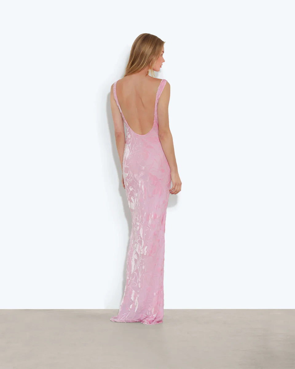 Woman wearing pink sleeveless maxi dress standing between dried palm fronds — Rat & Boa | Endless UAE