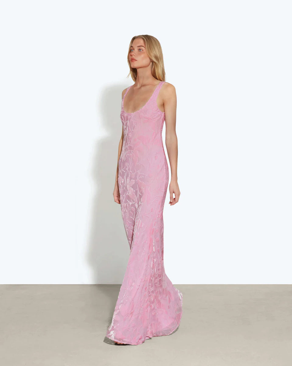 Woman wearing pink sleeveless maxi dress standing between dried palm fronds — Rat & Boa | Endless UAE