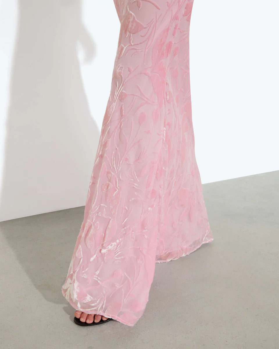 Woman wearing pink sleeveless maxi dress standing between dried palm fronds — Rat & Boa | Endless UAE