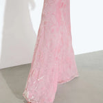 Woman wearing pink sleeveless maxi dress standing between dried palm fronds — Rat & Boa | Endless UAE