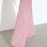 Woman wearing pink sleeveless maxi dress standing between dried palm fronds — Rat & Boa | Endless UAE