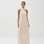 Elegant ivory halter neck maxi dress with high neckline and flowing silhouette — Nora The Label | Endless UAE