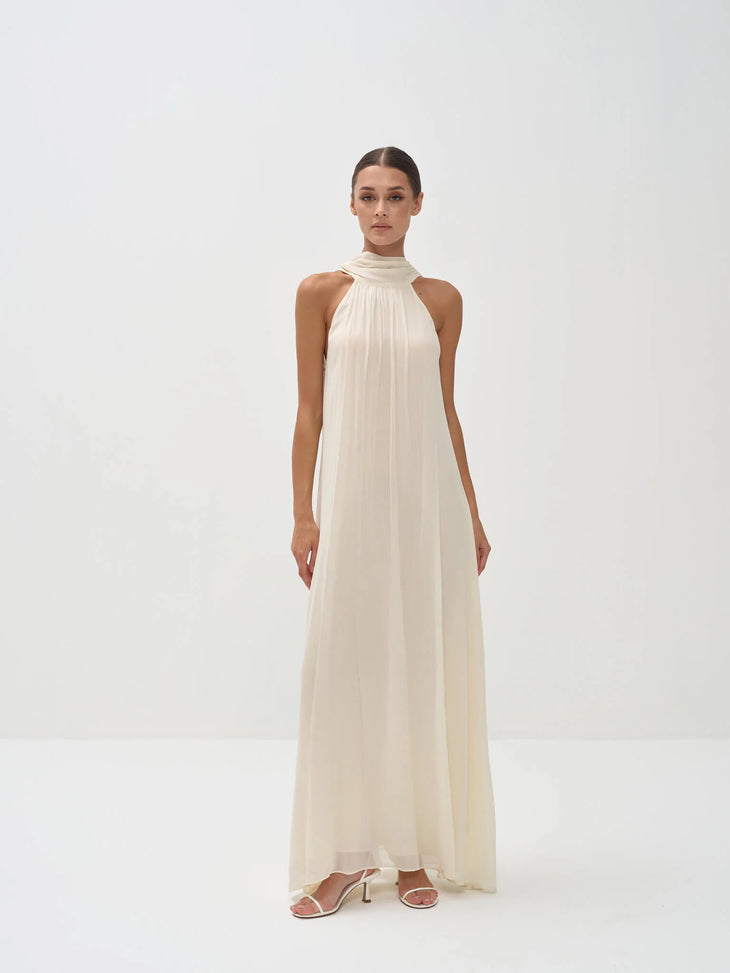 Elegant ivory halter neck maxi dress with high neckline and flowing silhouette — Nora The Label | Endless UAE