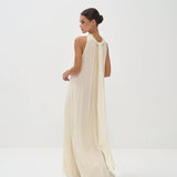 Elegant cream halter neck maxi dress with flowing silhouette and floor-length hem — Nora The Label | Endless UAE